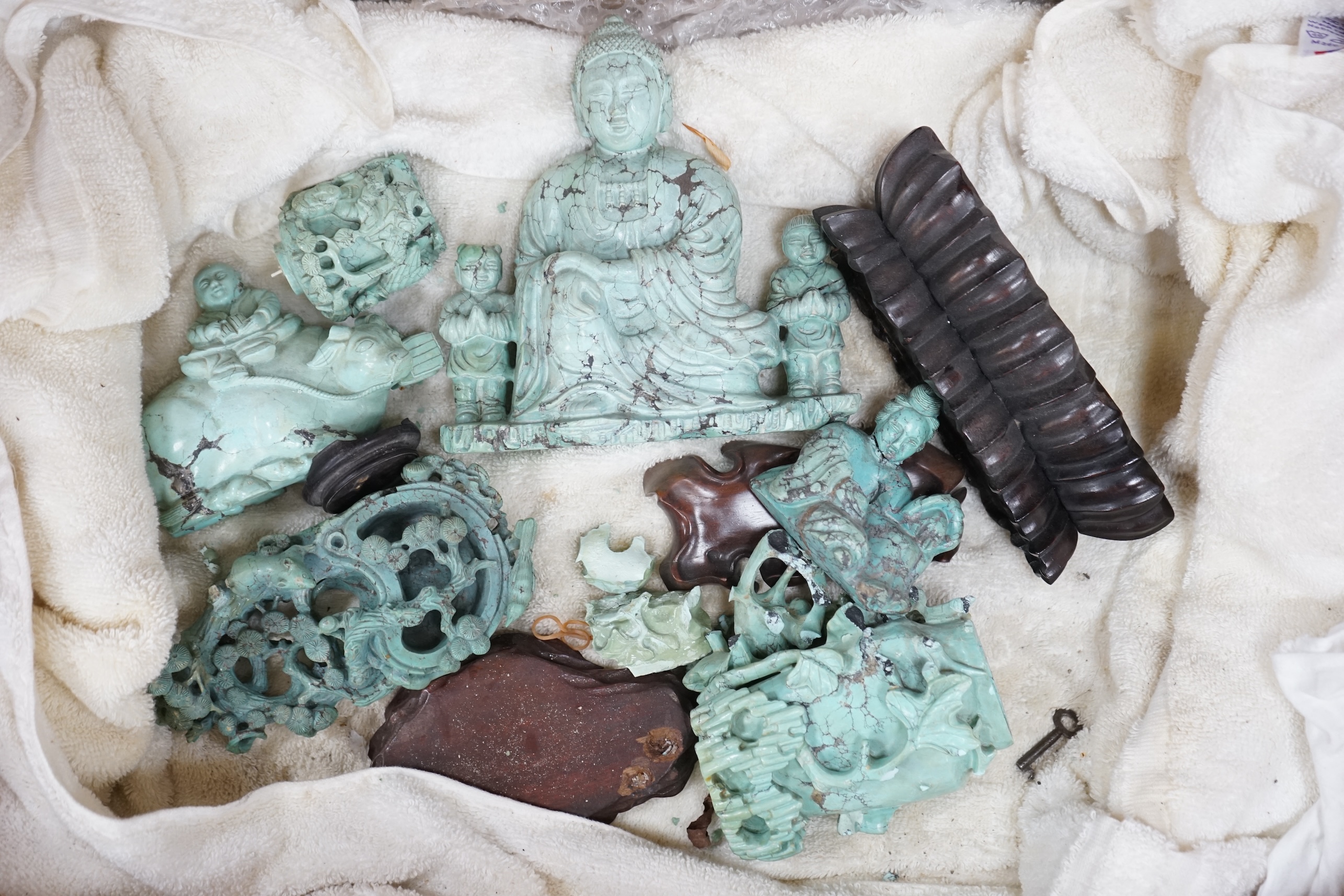 A group of Chinese turquoise matrix carvings, comprising a boy on a buffalo, 5.5in. a brushwasher, 7in. a vase and cover, 6.5in. a snuff bottle and a figure of a woman, 4.5in. (all a.f.)